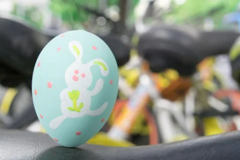 Green easter eggs standing on the black leather, ready for the egg hunter tra Stock Photos