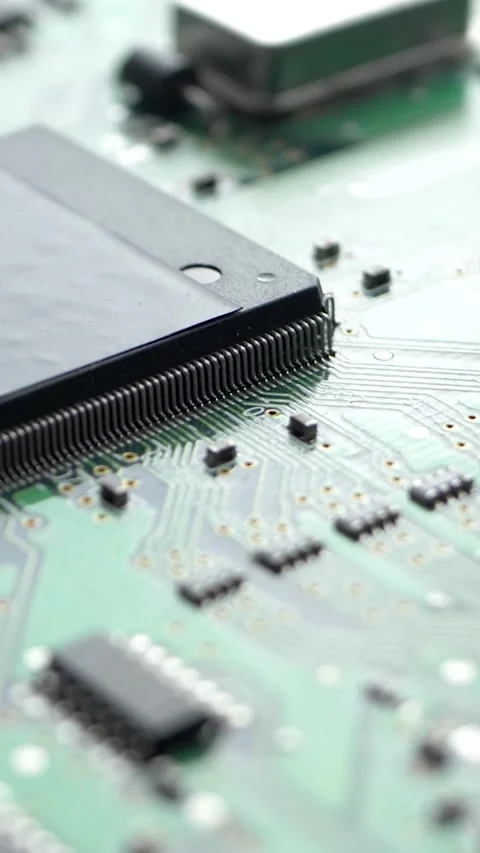 Green electronic circuit board with processor, chips and capacitors Stock Footage 280178987