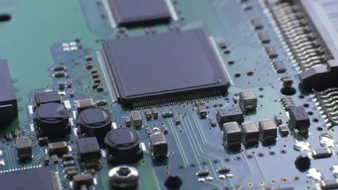 Green electronic circuit board with processor, chips and capacitors Stock Footage 281566201