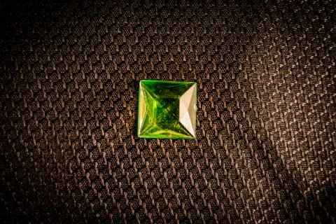 Green emerald gem stone on black background Stock Photos