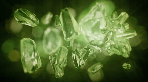 Green, emerald shiny  crystals or shattered glass slowly rotating in the air. Stock Footage 44560489