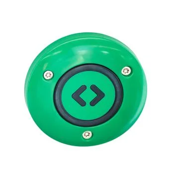Green emergency button on the door of a train, close-up, isolated on white .. Photos