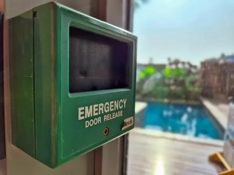 Green emergency door release button box Stock Photos