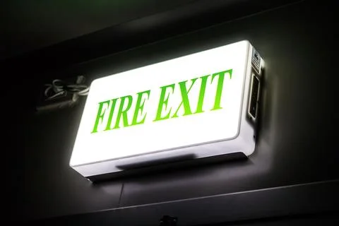 Green emergency exit Stock Photos