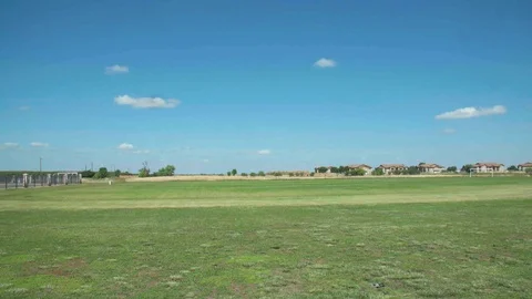 Green empty field with bright blue sky 動画素材 105424951