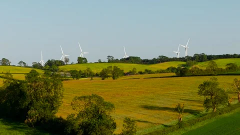 Green energy operating through modern wind turbines above rural landscape Stock Footage 344537928