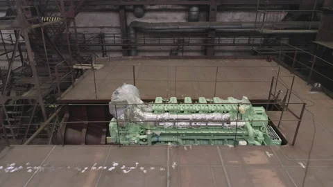 Green engine in hold of old repairing crab ship in dry dock Stock Footage 158943412