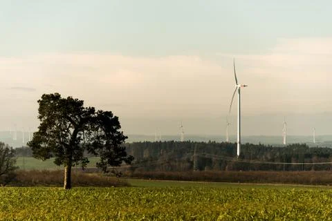 Green environment tree panorama view over wind farm landscape in Germany with Stock Photos