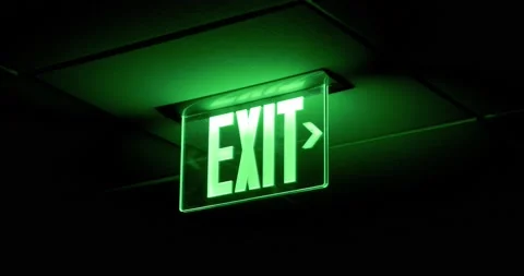 Green Exit Sign Glows in the Dark Stock Footage 221425621