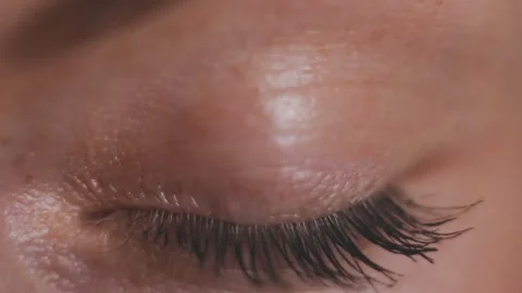 Green eye The iris of the human eye is narrowed. Close up of attractive blinking Stock Footage 158965085