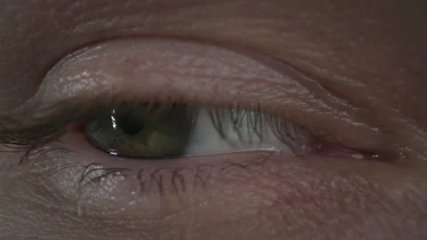 Green eye slowly looking around, close-up Stock Footage 307711565