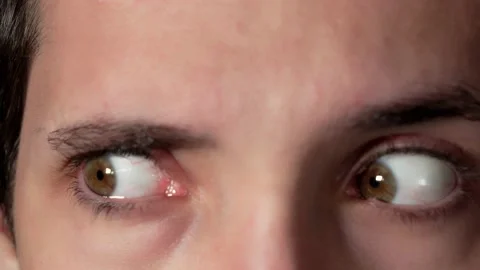 Green eyes moving out of sync Stock Footage 218062049
