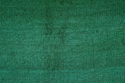 Green fabric close up. rough surface texture Stock-Fotos