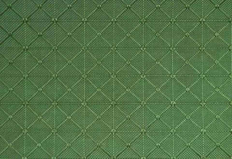Green fabric surface texture with squares and triangles, reliefs Stock Photos