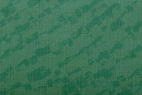Green fabric texture featuring an abstract geometric pattern, providing Illustrazione stock