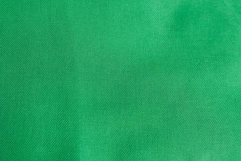 Green fabric texture or background for design with copy space for text or image. Stock Photos