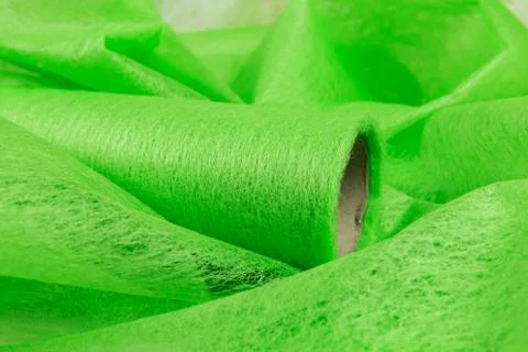 Green felt for decor in a roll Stock Photos