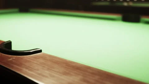Green Felt Pool Table Awaits the Next Game at a Lively Bar Stock Footage 344910196