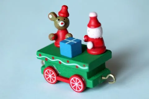Green festive wooden train car or carriage on white background Stock Photos