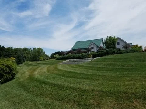 Green field and building Stock Photos