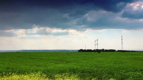 Green field and cloudy sky Stock Footage 24810916