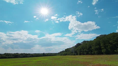 Green field and cloudy sky Stock Footage 25747847