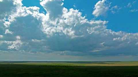 Green field and cloudy sky. 4K. FULL HD, 4096x2304. Stock Footage 34336812