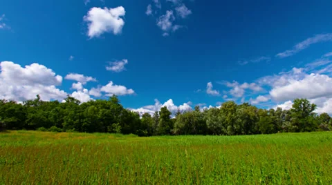 Green field and cloudy sky. 4K. FULL HD, 4096x2304. Stock Footage 39448580