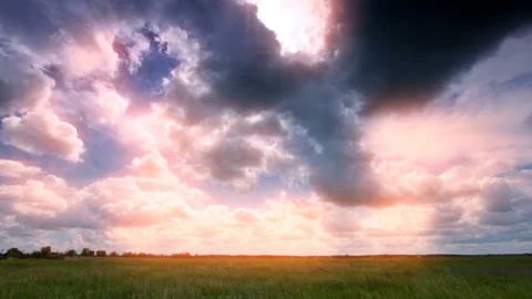 Green field and cloudy sky. 4K sunset. Stock Footage 129831200