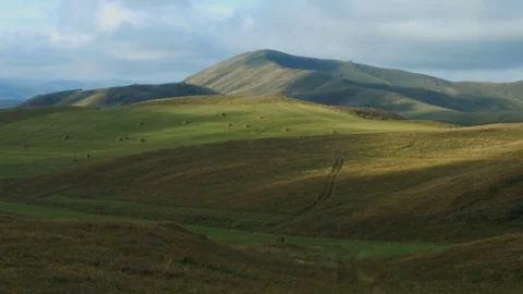 Green field with haystacks time lapse Stock Footage 78589801