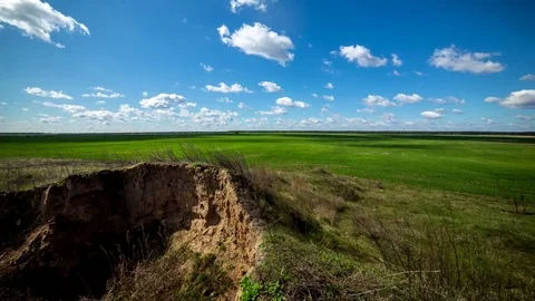 Green field. Sandy hill, floating clouds. Stock Footage 74613321