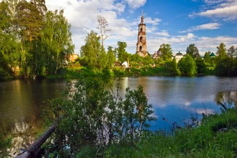 Green field with small river Stock Photos