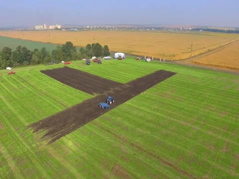 Green Field With Tractor From up Above Stock Footage 73717550