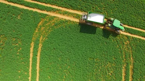 Green field with tractor. 스톡 동영상 74198302