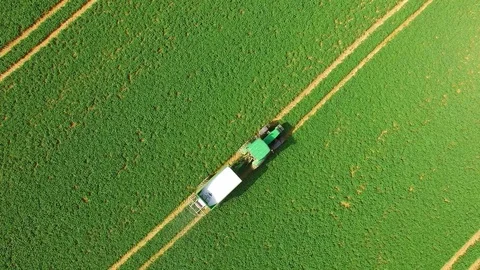 Green field with tractor. Stock Footage 74198690