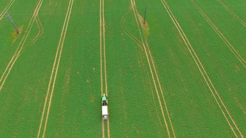 Green field with tractor. Stock Footage 74199424