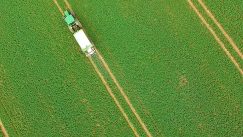 Green field with tractor. Video stock 74200317