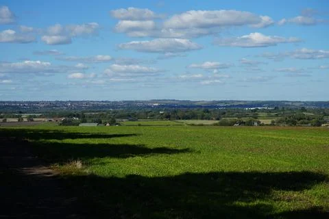 Green fields and distant town near Clipston Woods, Nottinghamshire Stock Photos