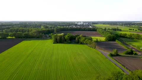 Green fields and farmland separated by roads and trees Video stock 293944115