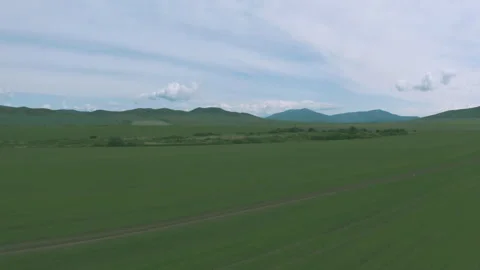 Green fields and high mountains 스톡 동영상 245614114