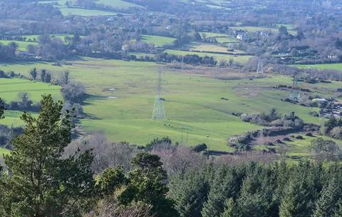 Green fields, and high voltage electric line in rural south Dublin, Ballycorus Stock Photos
