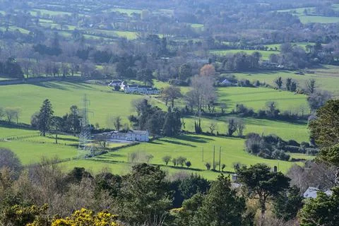 Green fields, and high voltage electric line in rural south Dublin, Ballycorus Stock Photos