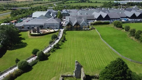 Green fields and modern residential buildings in a rural-urban mix. Stock Footage 327624135