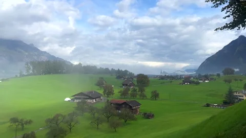 Green Fields and Mountain Views in the Swiss Alps Stock Footage 289370714