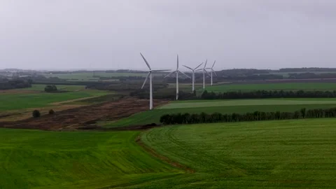 Green fields and wind turbines on a cloudy day in Denmark. Stock Footage 337152341