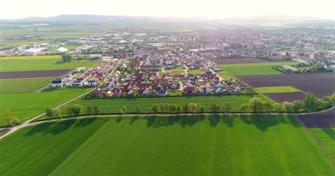 Green fields around a small town. Beautiful European landscape. Small European Stock Footage 256905299