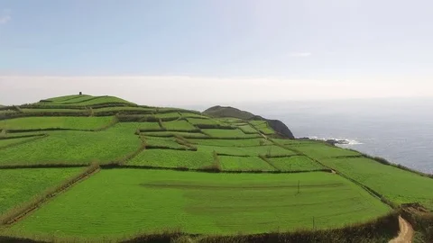 Green fields of Azores with atlantic ocean on background Stock Footage 75303568