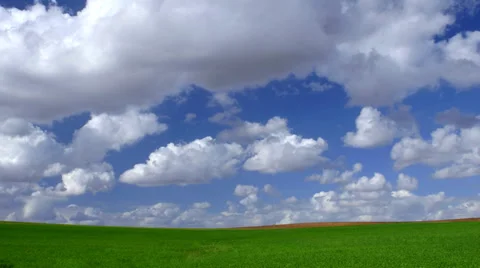 Green fields with blue sky and clouds, time lapse Video stock 36791688