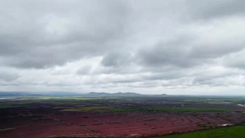 Green Fields Crops Agriculture Soil Fields Crops Cloudy Mountain in the Distance Video stock 235594923