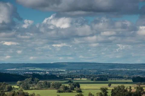Green fields, green meadows, dark forests and the cloudy sky Foto stock